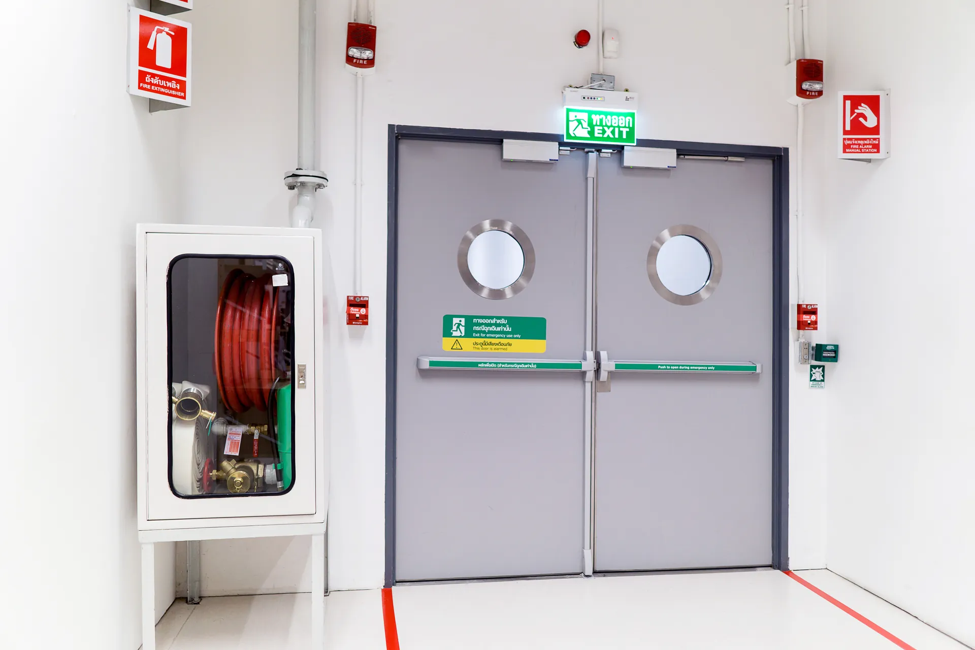 Timber doors lining a finished commercial corridor