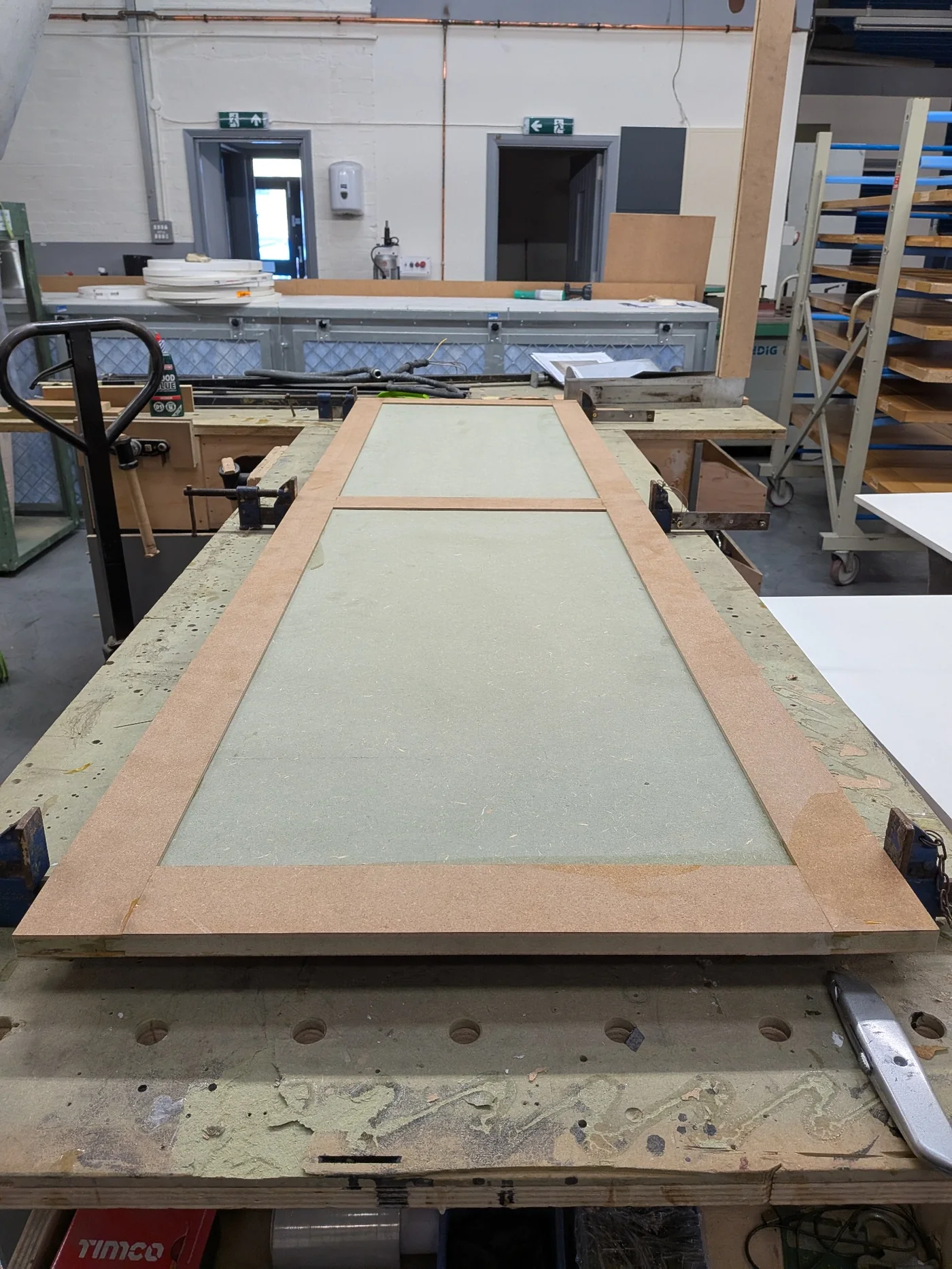 Door under preparation on a workshop bench